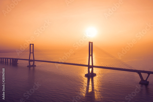Silhouette of Suramadu bridge at sunset