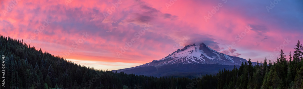 Beautiful Panoramic Landscape View of Mt Hood during a dramatic cloudy sunset. Taken from Trillium Lake, Mt. Hood National Forest, Oregon, United States of America.