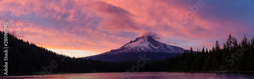 Beautiful Panoramic Landscape View of Mt Hood during a dramatic cloudy sunset. Taken from Trillium Lake, Mt. Hood National Forest, Oregon, United States of America.