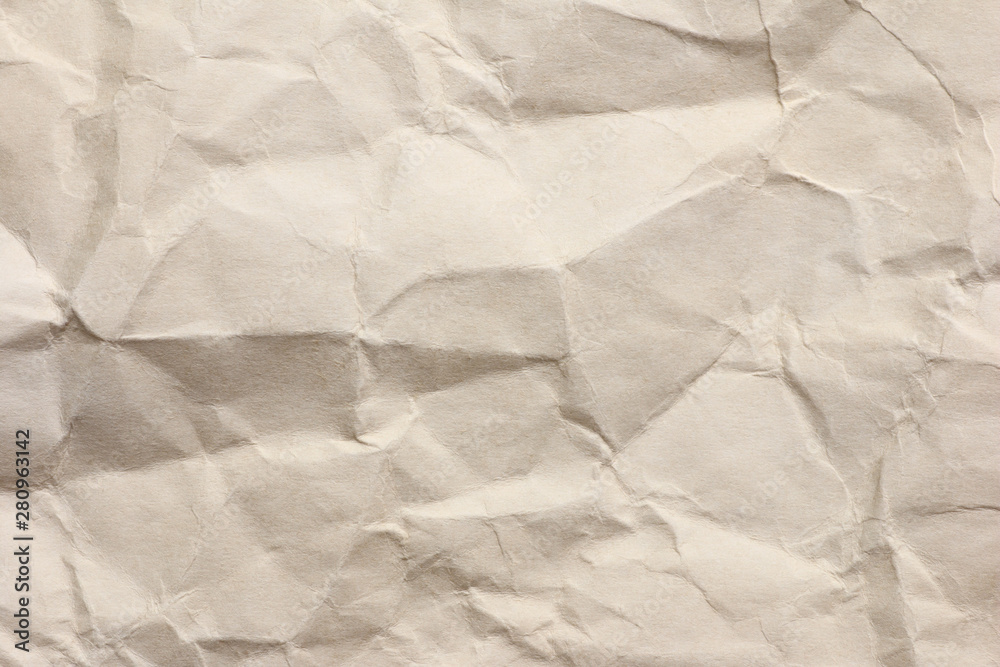Fototapeta premium Clean brown paper, wrinkled, abstract for background.