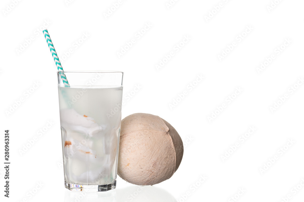Fresh coconut juice in a glass with coconut white meat isolated on white Fresh coconut juice in a glass with coconut white meat isolated on white