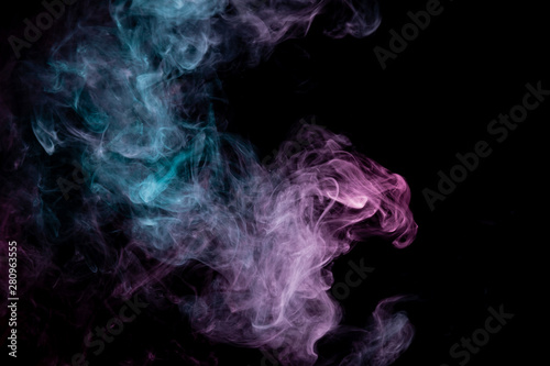 Colored background with winding clouds of smoke from patterns of different forms of pink  green and blue colors with tongues of flame on a black isolated background. Print for t-shirt.