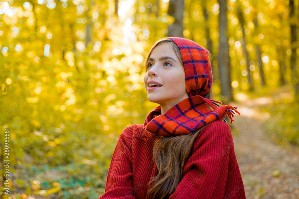 Perfect Woman Fashion Model with Fall Maple Leaf Outdoors. Autumn woman in autumn park with red pullover. Romantic Young Woman on Natural Background Outdoors. Perfect Woman Fashion Model with Fall Maple Leaf Outdoors. Autumn woman in autumn park with red pullover. Romantic Young Woman on Natural Background Outdoors.