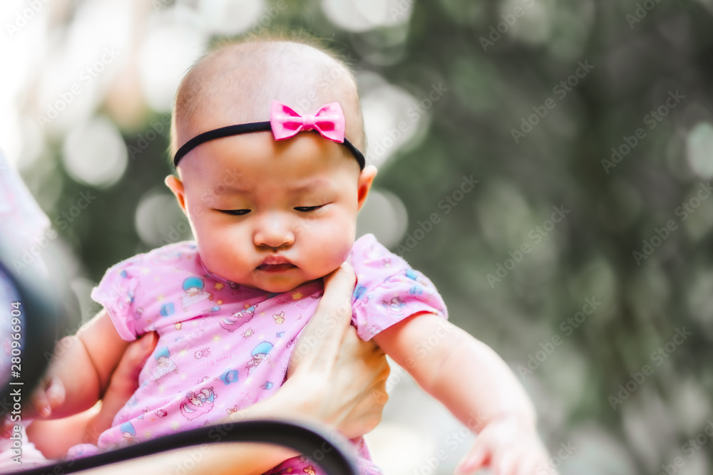 Asian baby happy in the garden.Asian baby girl happy family time. Asian baby happy in the garden.Asian baby girl happy family time.
