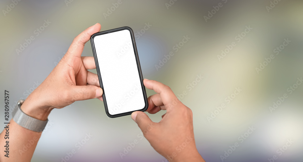 Cropped view of man's hand holding smartphone