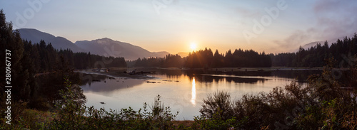Beautiful Panoramic View of Canadian Landscape during a sunny summer sunrise. Taken at Port Renfrew, Vancouver Island, BC, Canada.