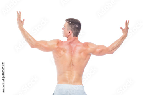 Powerful back. Strong Athletic Man - Fitness Model showing his perfect body isolated on white background with copyspace. Bodybuilder man with perfect abs, shoulders,biceps, triceps and chest.