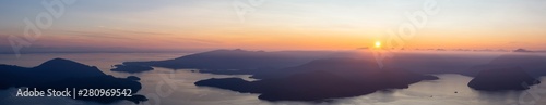 Beautiful Panoramic View of Canadian Mountain Landscape covered in clouds during a vibrant summer sunset. Taken on top of St Mark's Summit, West Vancouver, British Columbia, Canada. © edb3_16