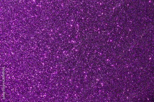 Dark purple color shiny glitter texture background with vibrant color photo