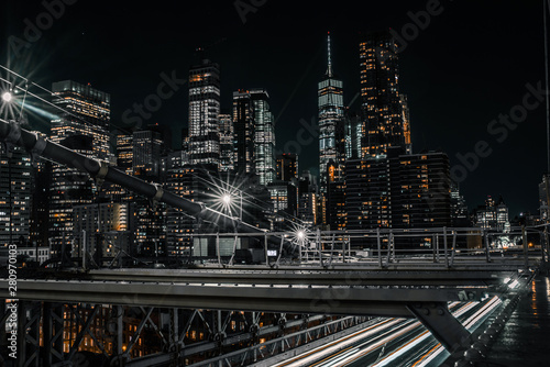 Brooklyn Bridge walking along it with views of the downtown Manhattan skyline