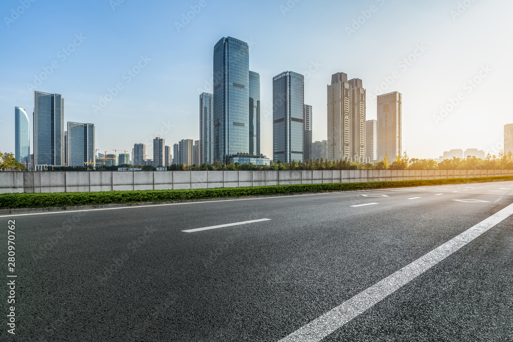 Empty asphalt road through modern city in Hangzhou, China