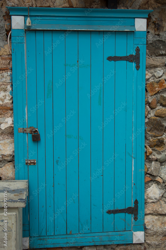 Old wooden door in authentic shapes and colors