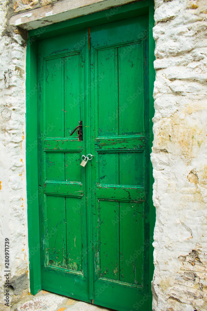 Old wooden door in authentic shapes and colors