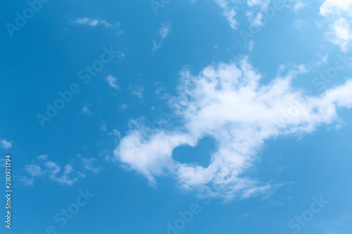 Fototapeta Naklejka Na Ścianę i Meble -  Blue sky background , white clouds with heart shaped patterns floating in summer day , copy space
