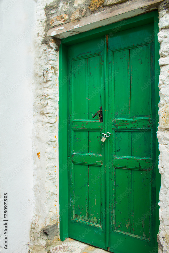 Old wooden door in authentic shapes and colors