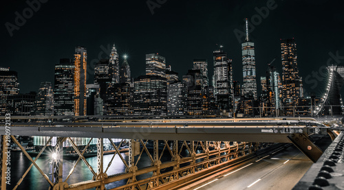 Downtown Manhattan from the Brooklyn bridge at night no traffic on bridge