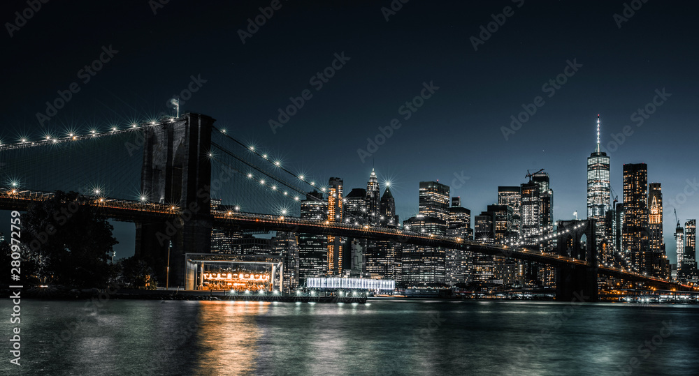 Brooklyn Bridge as night just starts to fall over New York City