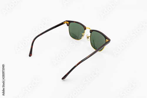 beautiful high quality sunglasses stylish on white background with shadow studio isolated stuff idea for long weekend holiday travelling in summer season vocation protect eyes from sunlight top view