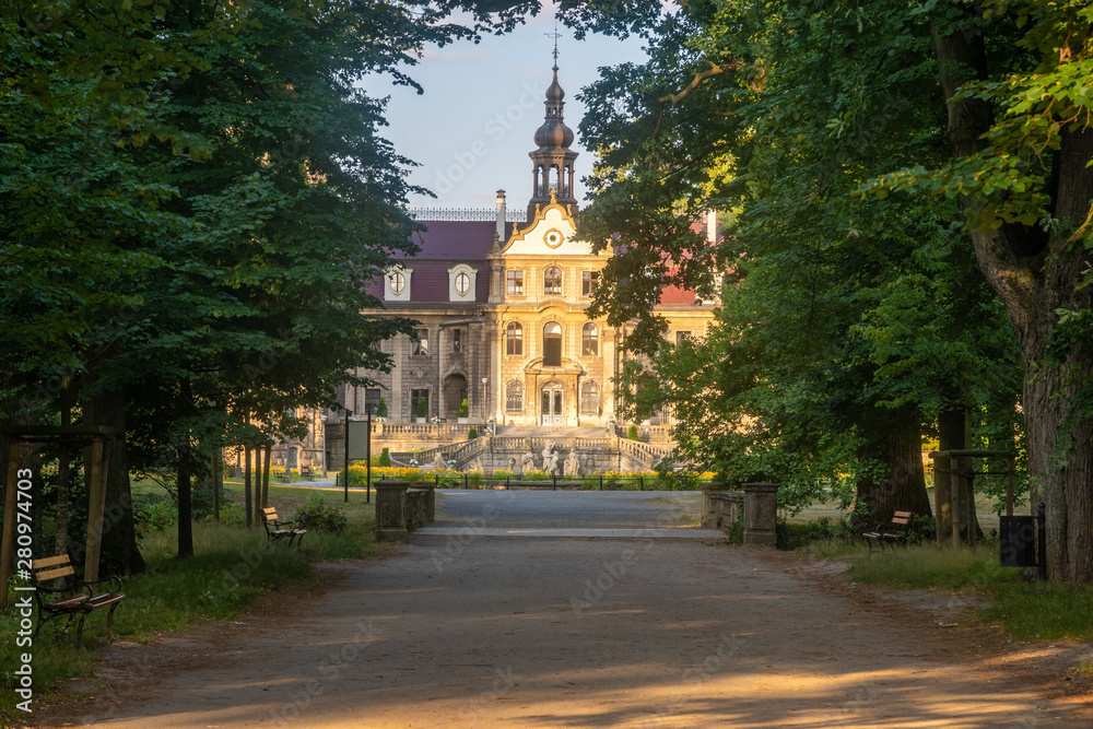avenue of trees leading to the castle,Castle in Moszna near Opole, Silesia, Poland.