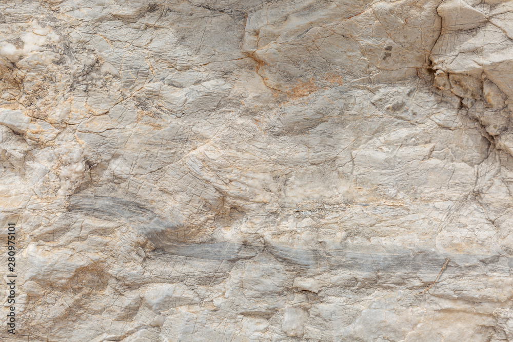 The texture of the surface of natural stone, close-up. Building material of ancient civilizations. Background. Spaces for text. The texture of the surface of natural stone, close-up. Building material of ancient civilizations. Background. Spaces for text.
