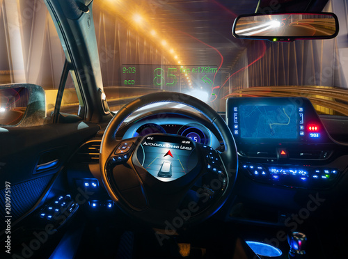 vision of an autonomous car driving at night in a lighted tunnel photo