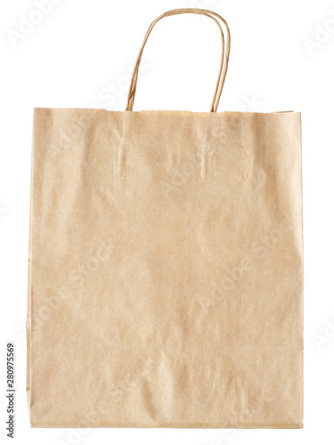New empty blank paper bag with handles without inscriptions and logos. Made from brown kraft paper. Isolated on white background.
