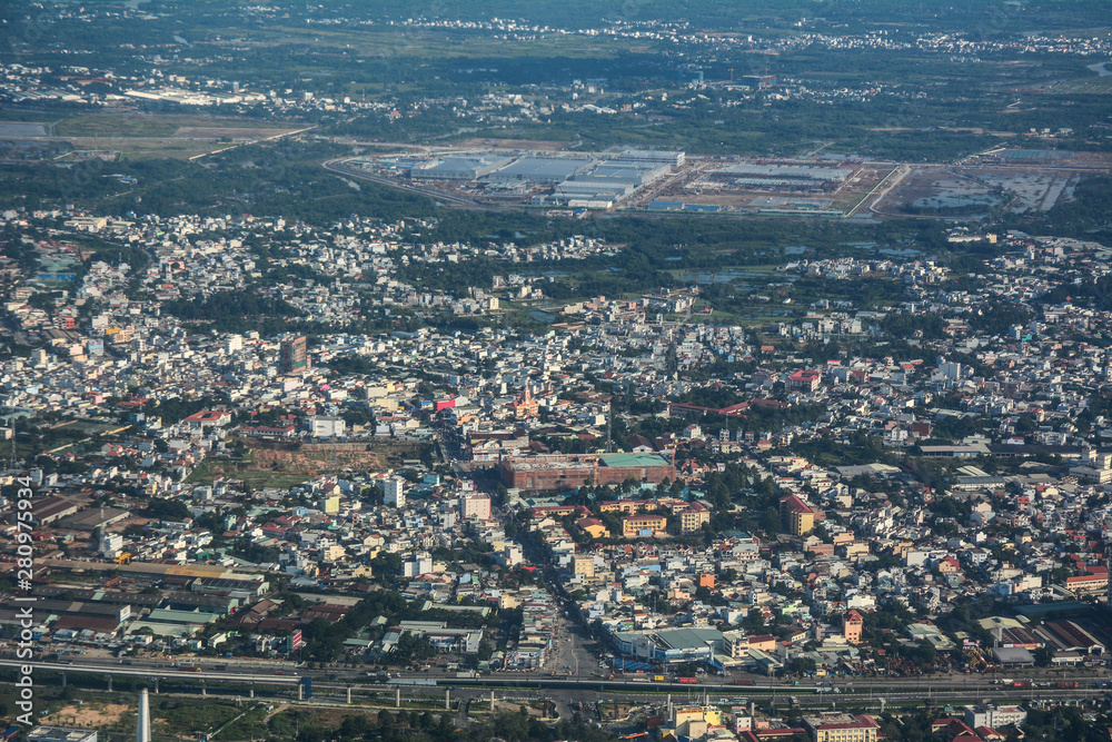 Aerial view of cityscape in sunny day