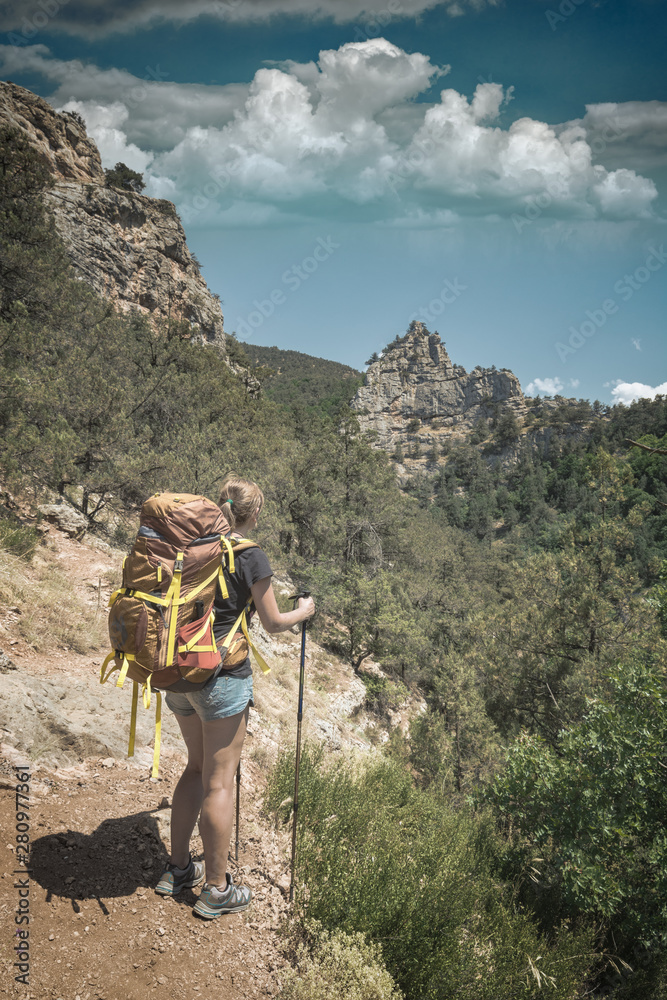 Fototapeta premium Girl hiker with backpack in a Crimea