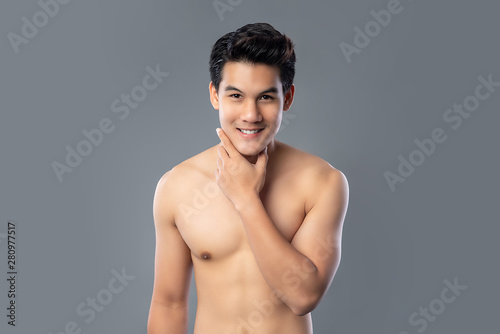 Portrait of shirtless smiling handsome Asian man