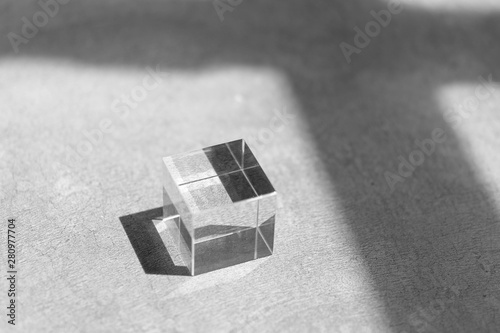 Fototapeta Naklejka Na Ścianę i Meble -  glass cube on a floor with shadow in monochrome, minimal style