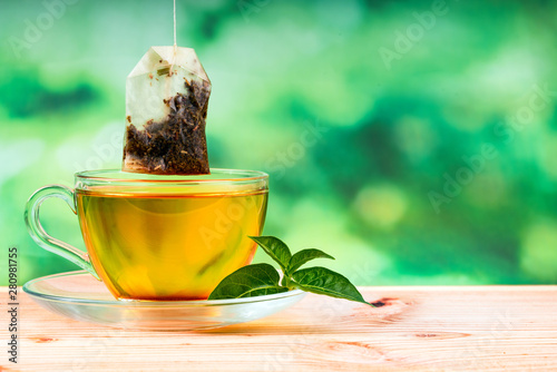 herbal tea bag and green background