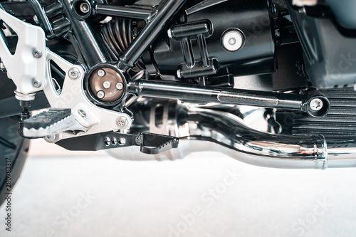 Cropped image of new motorcycle in shop.