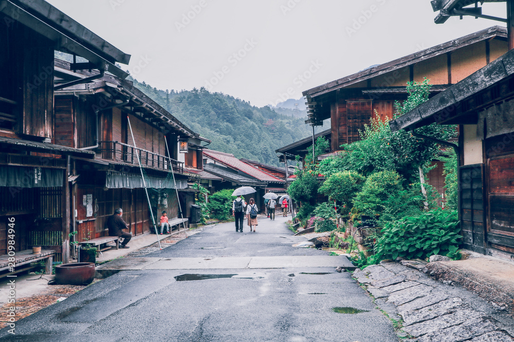 KISO VALLEY, JAPAN - June 10, 2018:Kiso valley is the old town or Japanese traditional wooden houses for the travelers walking at historic old street in Narai-juku , Nagano Prefecture, JAPAN. KISO VALLEY, JAPAN - June 10, 2018:Kiso valley is the old town or Japanese traditional wooden houses for the travelers walking at historic old street in Narai-juku , Nagano Prefecture, JAPAN.
