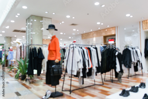 Blurred showcases fashion boutique Clothing store in a modern shopping mall. Cloth and acessorie modern shop blur background.