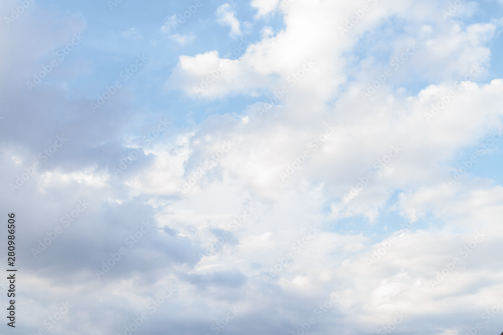 White fluffy clouds in the blue sky in summer White fluffy clouds in the blue sky in summer