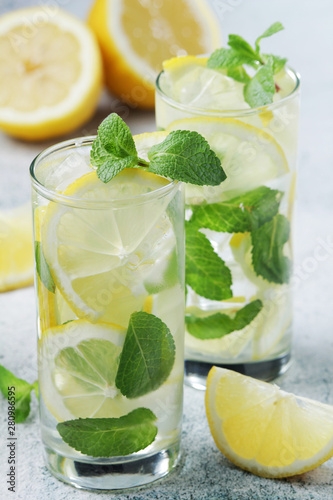 Lemon and mint refreshing cocktail with ice cubes