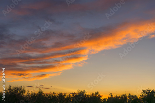 .Dramatic sky. Very beautiful sunset. Yellow orange skies. Dusk. Beautiful landscape. Background.