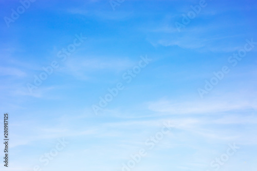 Blue sky background and white clouds soft focus, and copy space photo