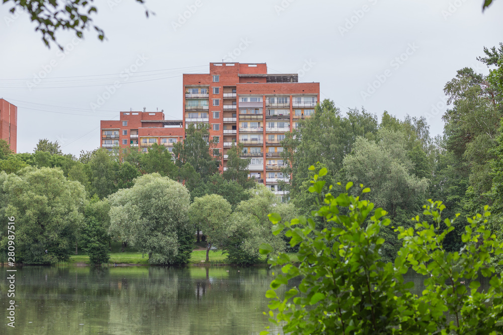 City Riga, Latvia Republic. Apartment house and nature. Riga neighborhood. Juny 29. 2019 Travel photo.