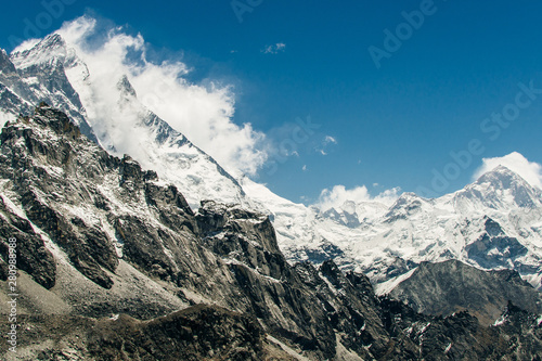 The himalayan peaks on blue sky background in the Everest region on a sunny day - Nepal, Himalayas photo