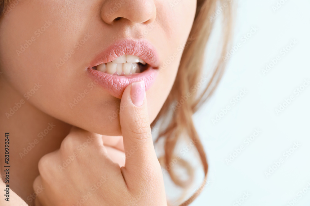 Young woman with beautiful lips, closeup