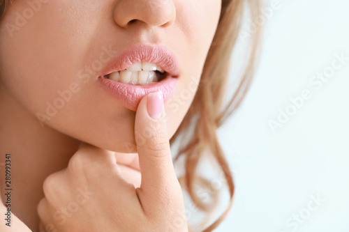Young woman with beautiful lips, closeup