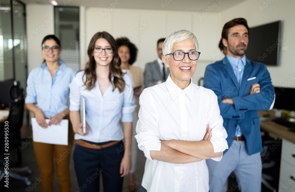 Group of successful business people at work in office Group of successful business people at work in office