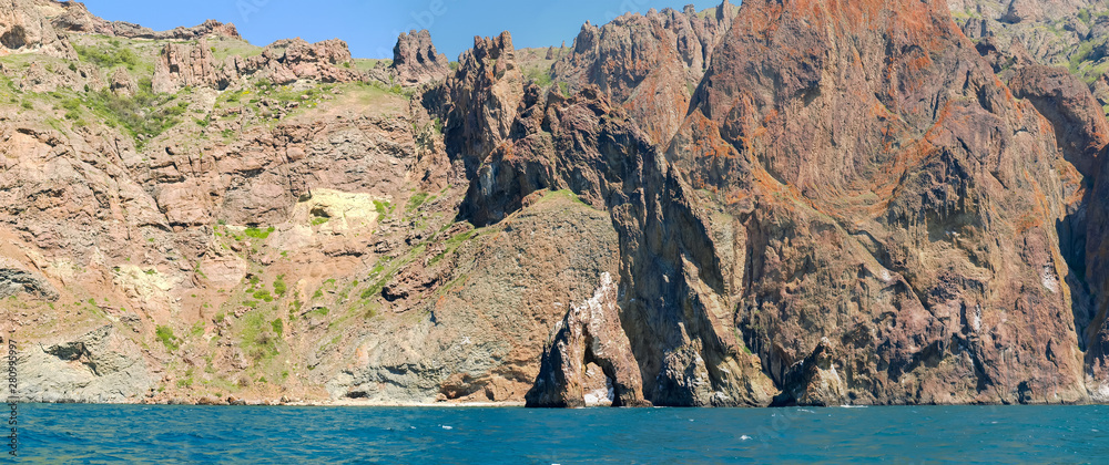 Part of coastal cliffs of volcanic origin on sea shore