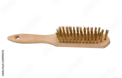 Wire brush with wooden handle isolated on a white background. Metal wire brush for rust removal