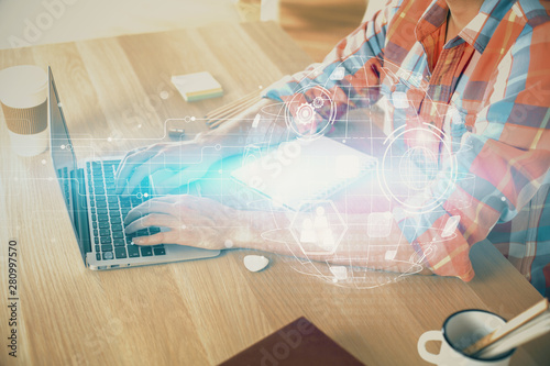 Social network theme hologram with businessman working on computer on background. Concept of world wide web. Double exposure.