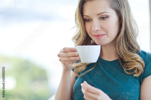 Woman drinking coffee. 