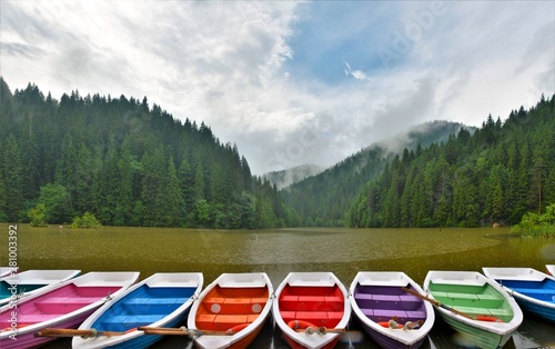 colorful boats lying on the shore of the lake