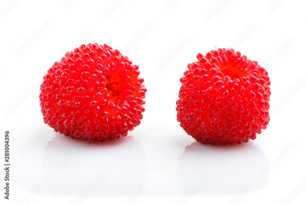 Two ripe red tibetian raspberry isolated on white background. side view. Two ripe red tibetian raspberry isolated on white background. side view.