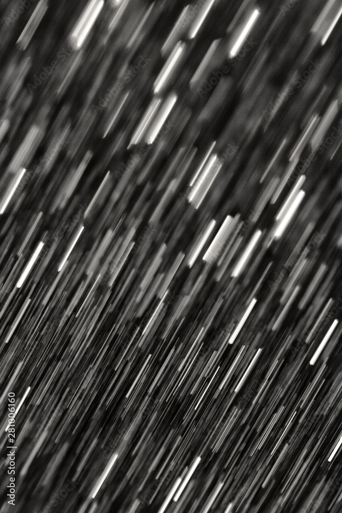 Obraz premium Abstract dynamic white lines on a black background in motion.